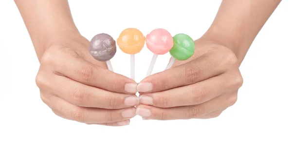 Hand holding lollipop candy isolated on white background — 스톡 사진
