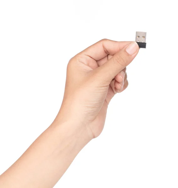 Mão segurando pequeno flash drive isolado em um fundo branco — Fotografia de Stock