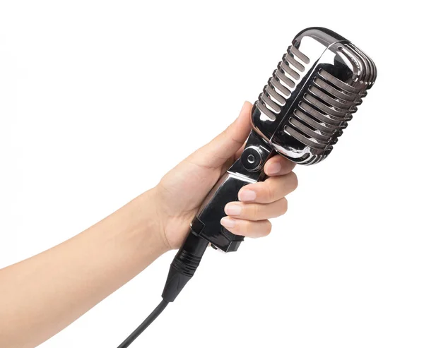 Hand holding a single retro microphone isolated on white backgro — Stock Photo, Image