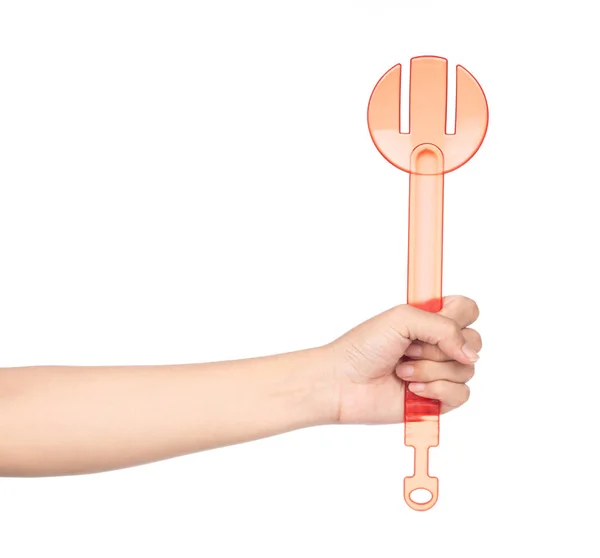 Hand holding plastic kitchen utensils isolated on a white backgr — Stockfoto