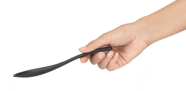 Hand hält Black of Spoon Isoliert auf weißem Hintergrund — Stockfoto