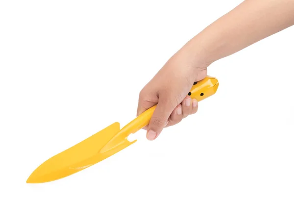Mão segurando espátula amarela isolada no fundo branco — Fotografia de Stock