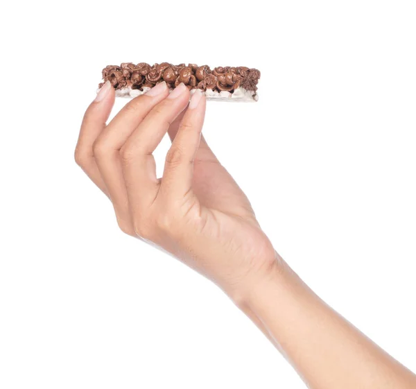 Hand holding Chocolate Cereal Bar isolated on white background — 图库照片