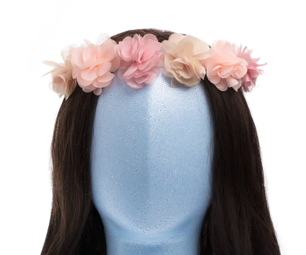 Beautiful flowers on mannequin head isolated on white background — Stock Photo, Image