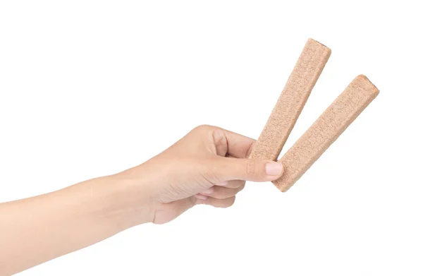 Hand holding Wafers stick isolated on a white background — ストック写真