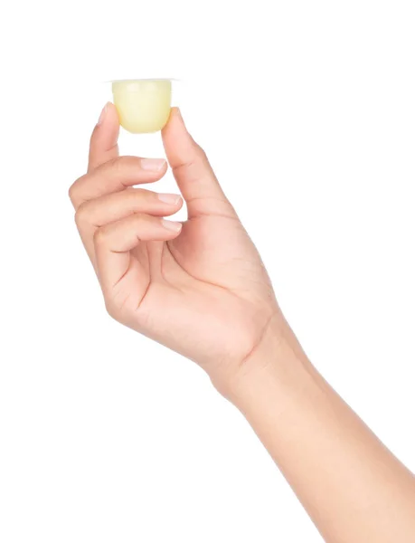 Handen håller gelé i plastbehållare isolerad på vit baksida — Stockfoto