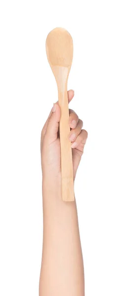Mano sosteniendo cuchara de madera aislada sobre fondo blanco — Foto de Stock