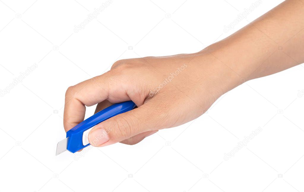 Hand Holding Use Stationery Knife Cutter isolated on a white bac