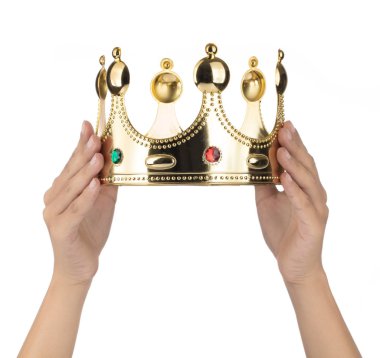 Hand holding Gold Crown with jewel isolated isolated on white ba