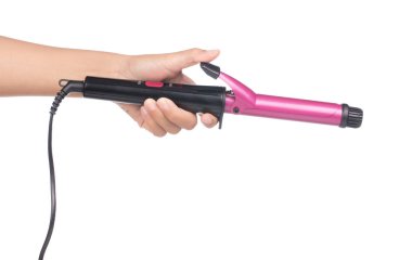 hand holding purple curling iron isolated on white background