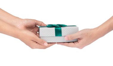 Hands giving and receiving a present isolated on white backgroun