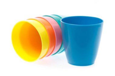 Empty colorful plastic glass isolated on white background