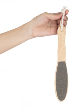 Hand holding stone scrub foot hygiene tool isolated on white bac