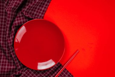 A red dish Kitchenware set on red background