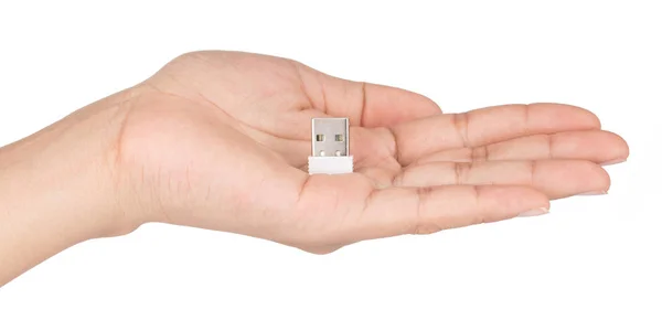 Mano sosteniendo Mini flash USB aislado sobre un fondo blanco . —  Fotos de Stock