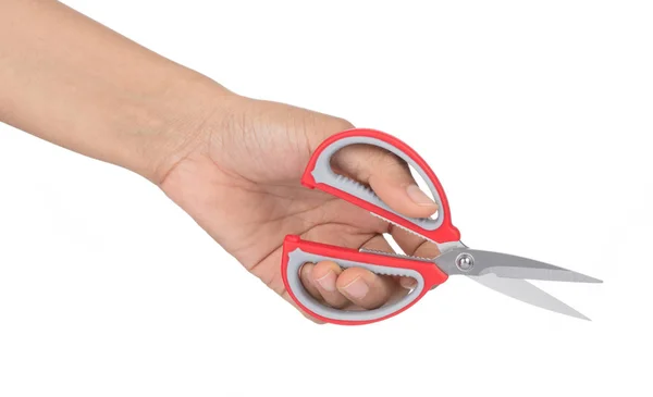 Ruka držící červené nůžky izolovaných na bílém pozadí. — Stock fotografie
