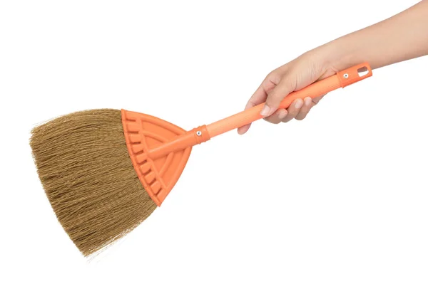 Hand holding Small broom isolated on white background — 스톡 사진