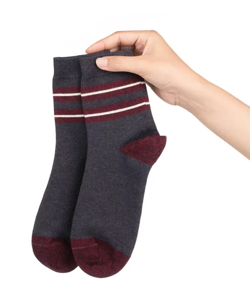 Рука тримає спортивні шкарпетки ізольовані на білому тлі — стокове фото
