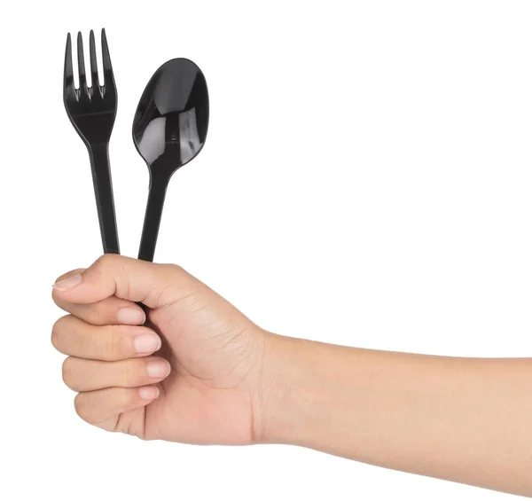 Hand holding Black plastic spoon and fork isolated on white back — 스톡 사진