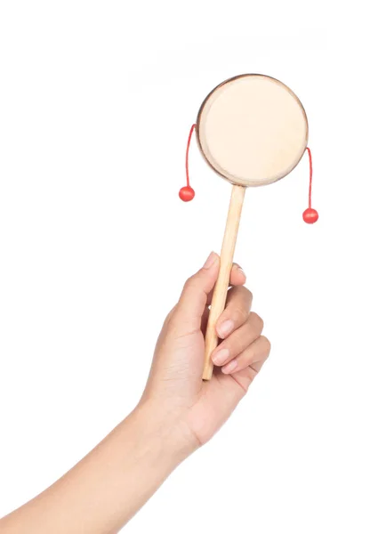 Hand holding Denden daiko folk art toy isolated on a white backg — 스톡 사진