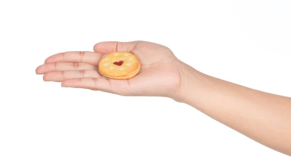 Hand holding round biscuit cookies or crackers with heart with s — Stock Photo, Image