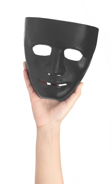 Hand hält schwarze Masken isoliert auf weißem Hintergrund — Stockfoto