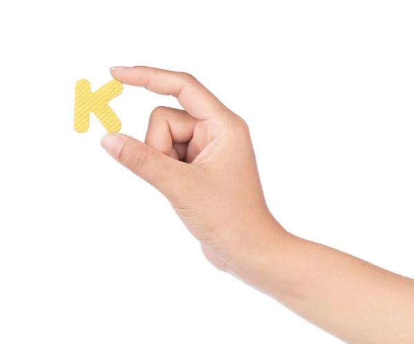 Mão segurando alfabeto feito de espuma EVA isolado em backg branco — Fotografia de Stock