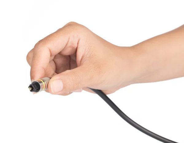 Ruka drží optický audio kabel izolované na bílém pozadí. — Stock fotografie