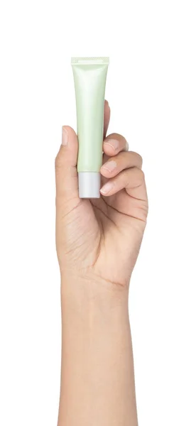 Hand hält grünen Kosmetikschlauch isoliert auf weißem Hintergrund. — Stockfoto