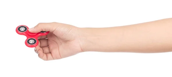 Prsty hrající červenou fidget spinner izolované na bílém backgro — Stock fotografie