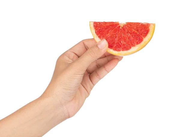 Hand holding ripe grapefruit slice isolated on white background. — Stock Photo, Image