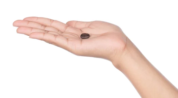 Roasted coffee bean on hand isolated on white background — Stok fotoğraf