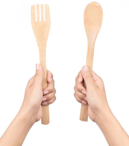 Hand holding wooden and fork spoon isolated on white background — Stock Photo, Image