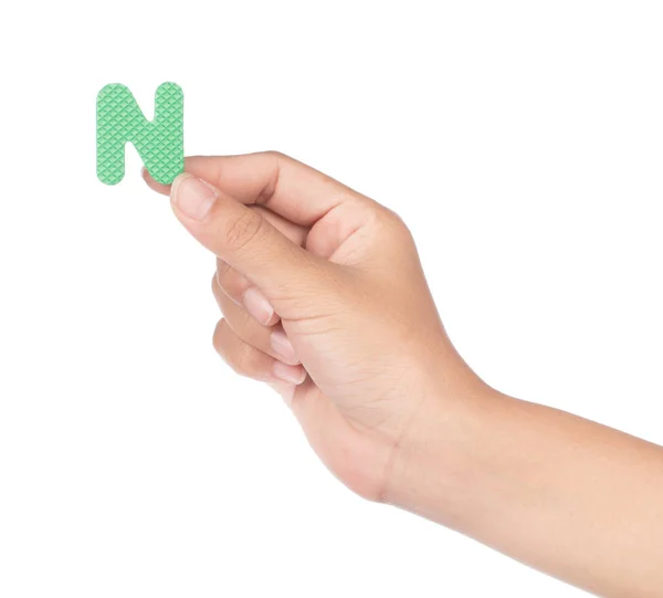 Mão segurando alfabeto feito de espuma EVA isolado em backg branco — Fotografia de Stock