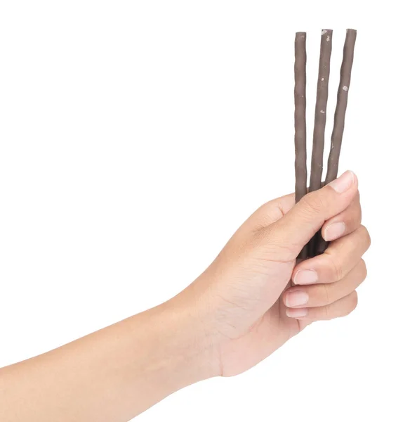 Tangan memegang cokelat tongkat kerupuk terisolasi pada backg putih — Stok Foto