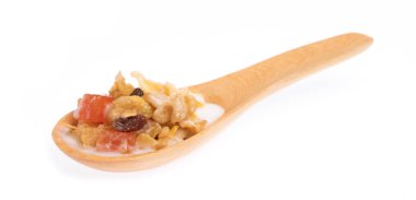 Cereal on wood spoon isolated on white background.
