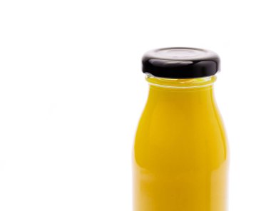 refreshing mango drink to bottle glass isolated on white backgro