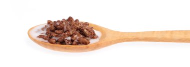 wood spoon of chocolate Cereal with milk isolated on white backg