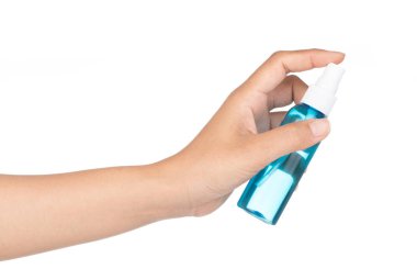 Handle a spray bottle to spray water mist in the air against a w