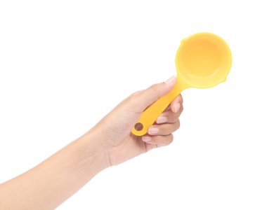 hand holding yellow plastic scoop isolated on white background