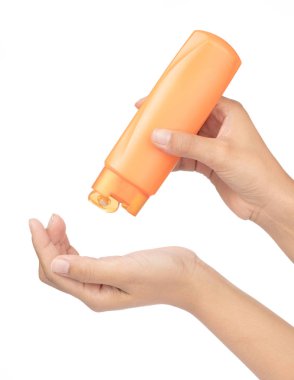 Hand holding Bottle of Hair conditioner is a hair care product i