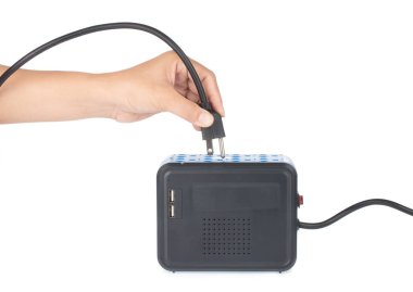 hand holding Automatic Voltage Regulators isolated on white back