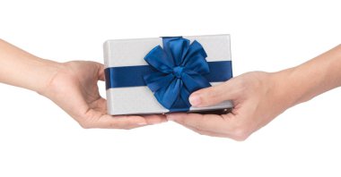 Hands giving and receiving a present isolated on white backgroun