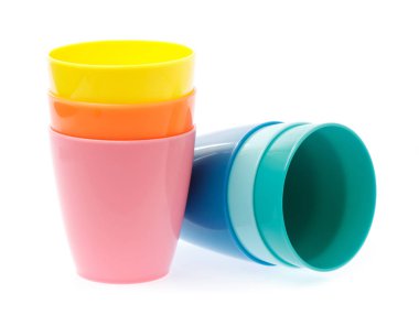 Empty colorful plastic glass isolated on white background