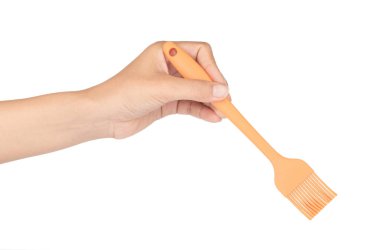 hand holding Silicone brush for cooking isolated on white backgr