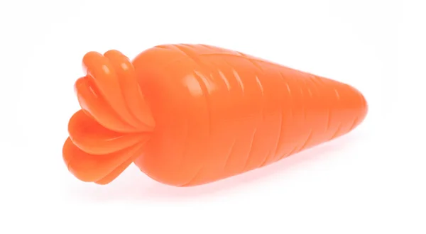Plastic toy carrot isolated on white background — Stockfoto