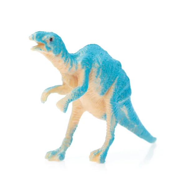 Juguete dinosaurio pequeño aislado sobre fondo blanco —  Fotos de Stock