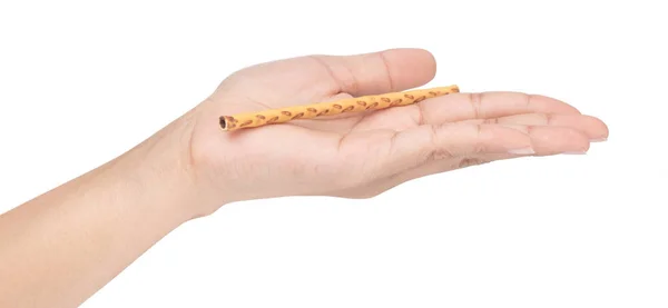 Hand holding salty cracker sticks isolated on white background — Stockfoto