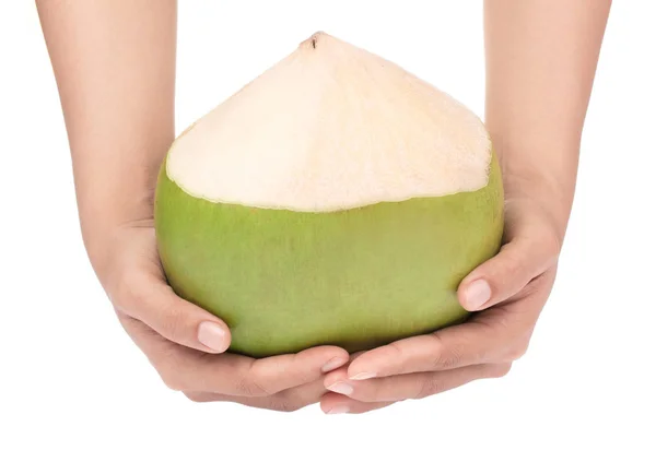 하얀 배경에 고립된 코코넛 열매를 손으로 잡고 있는 모습 — 스톡 사진