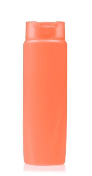 Pomerančová plastová láhev šampónu izolované na bílém pozadí — Stock fotografie